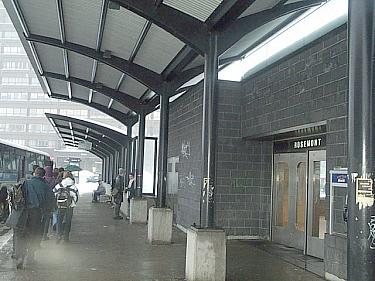 Bus shelter canopies by an entrance door