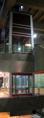 Elevator between the mezzanine and the upper platform