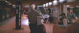 The Jackal (Bruce Willis) seizes a hostage in The Jackal
