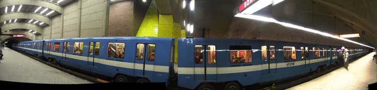 An orange-line MR-73 train at Place-Saint-Henri station