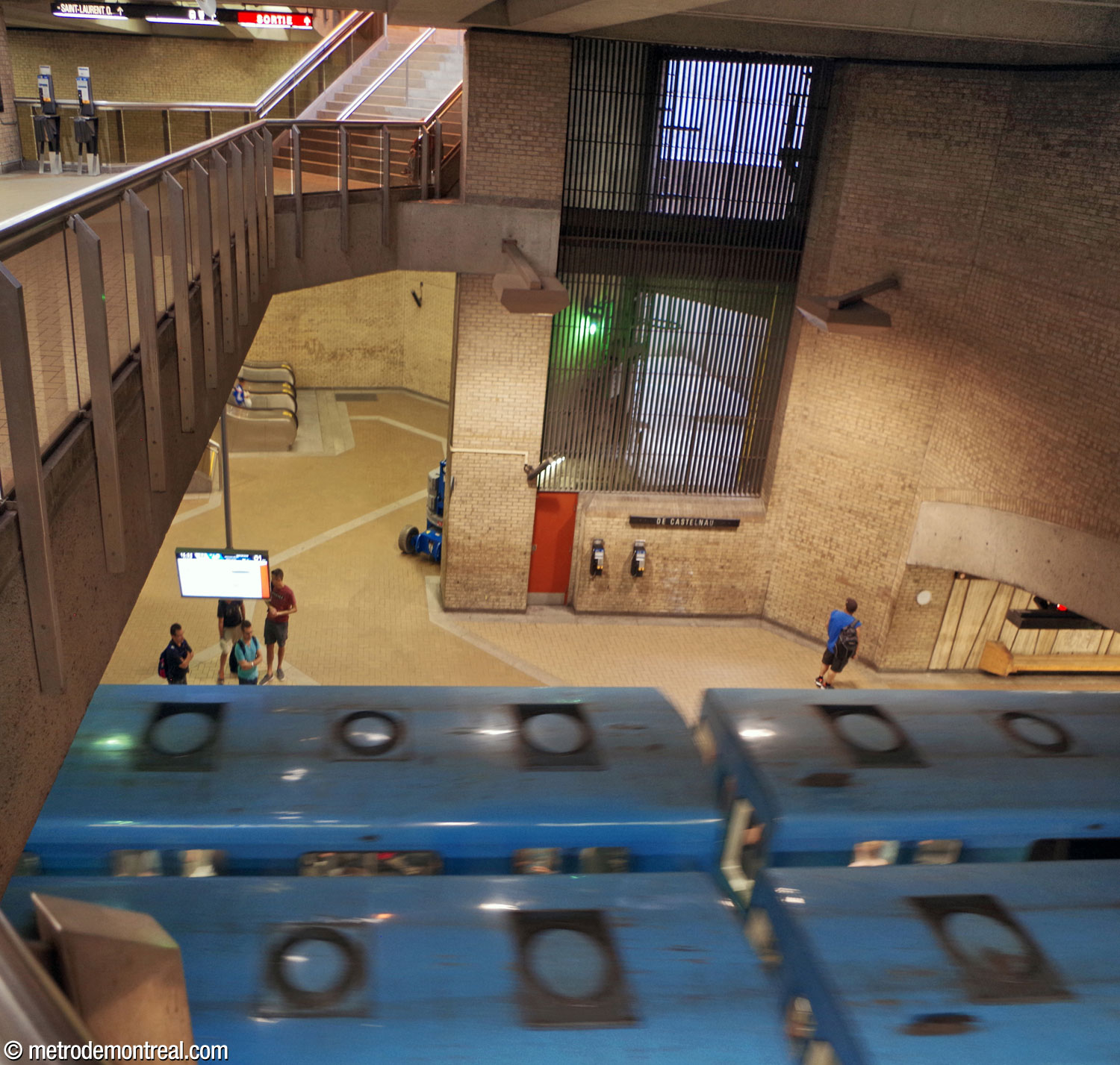 View onto the main volume from the north end of the overlook on the mezzanine level. The Saint-Michel platform is visible below, with a ventilation shaft rising above it.