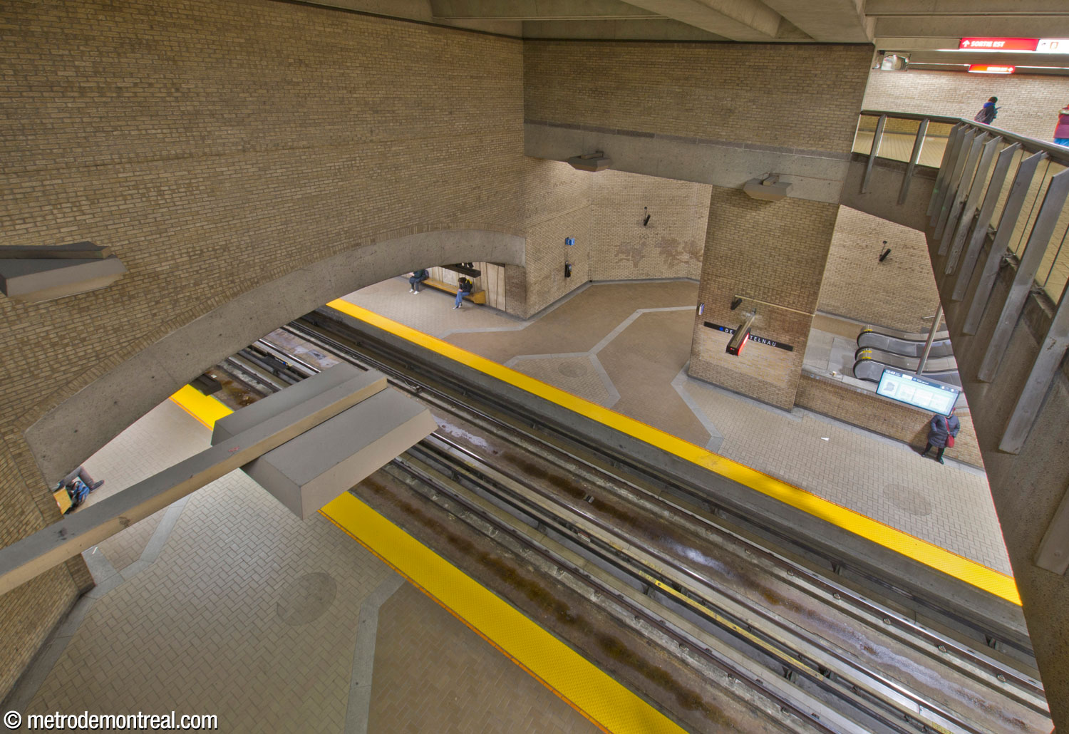 View onto the main volume from the south end of the overlook on the mezzanine level. The Snowdon platform is visible across the tracks, with the spandrel wall on the west side of the volume rising above the arch of the trainroom vault.