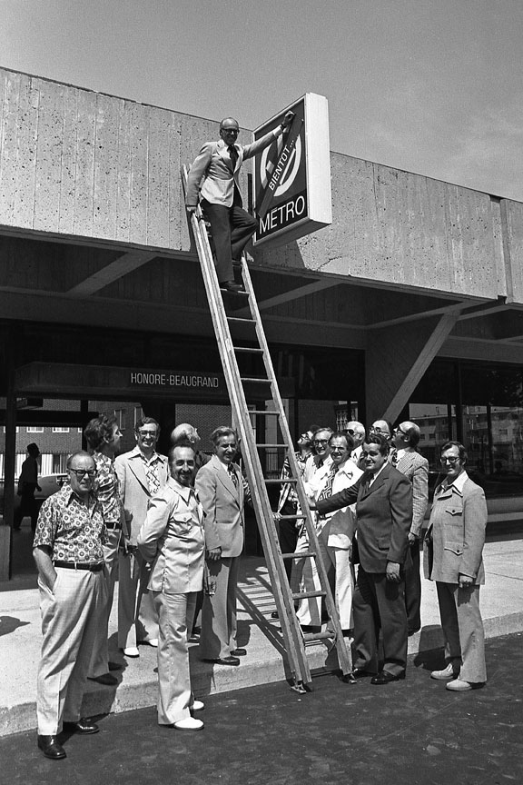 CTCUM chairman Lawrence Hanigan removes a sticker saying “Soon” covering the metro sign on the station’s opening day, June 6, 1976.