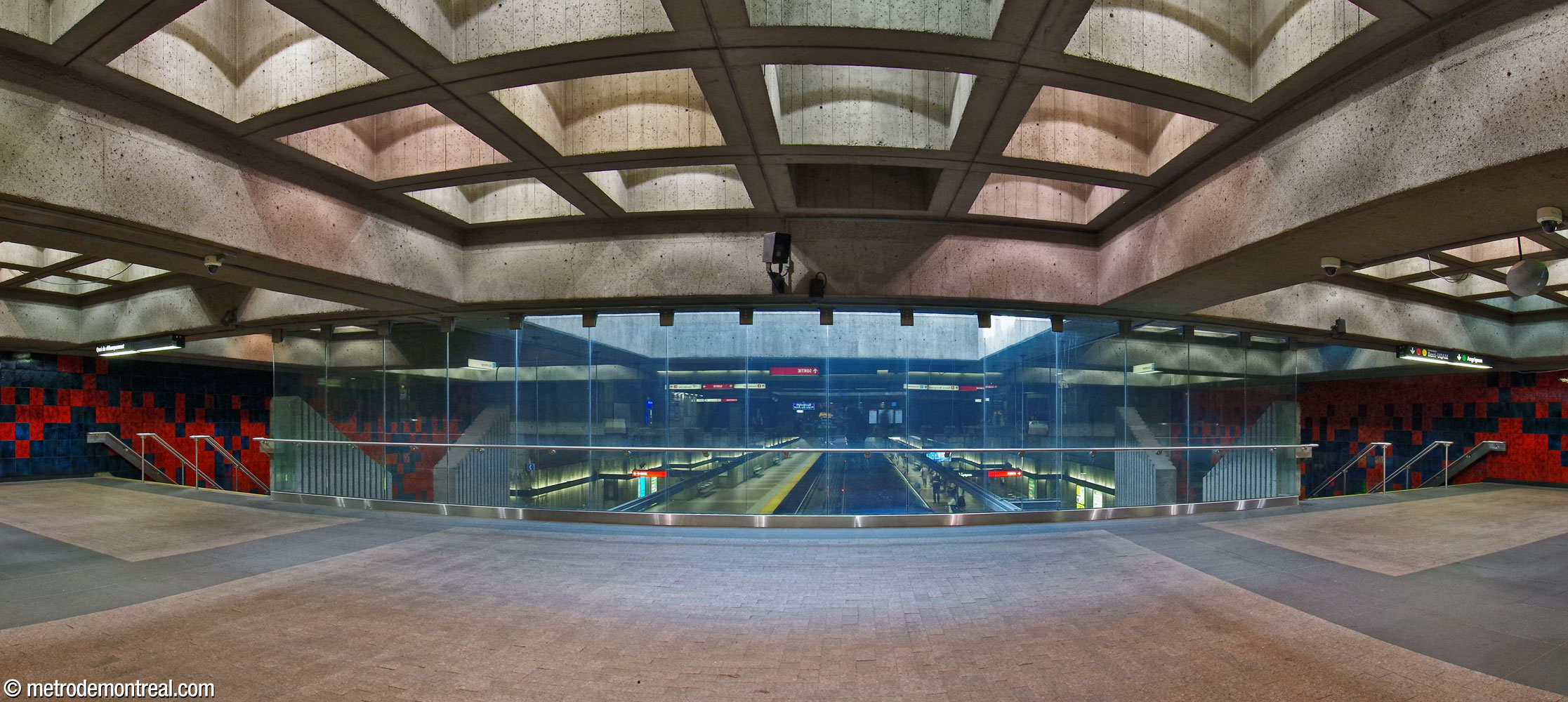 The parapet overlooking the platforms from the ticket hall, now enclosed for fire safety. The volume beyond is lit by a skylight.
