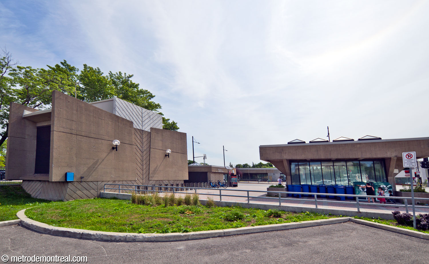 A ventilation shaft (left) echoes the shape of the platform staircases, and frames a small plaza between the concourse light shaft (right) and the Sherbrooke Nord headhouse (centre background).
