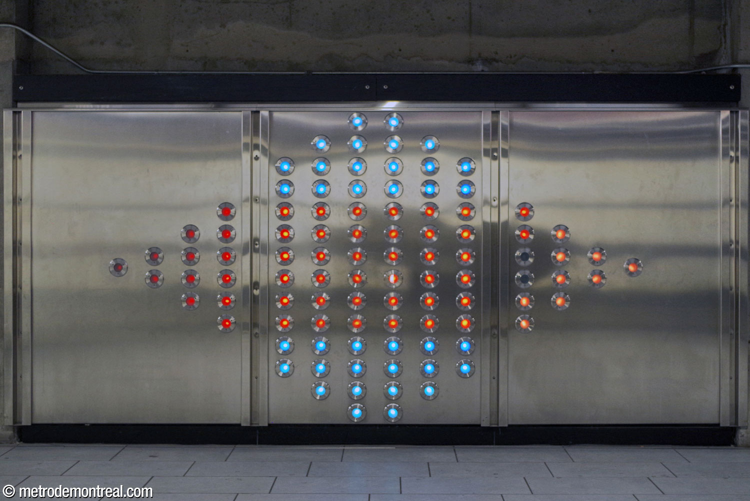 One of the two sections of Axel Morgenthaler's light installation .98, featuring a diamond-shaped array of 98 LED light fixtures displaying constantly shifting coloured motifs.
