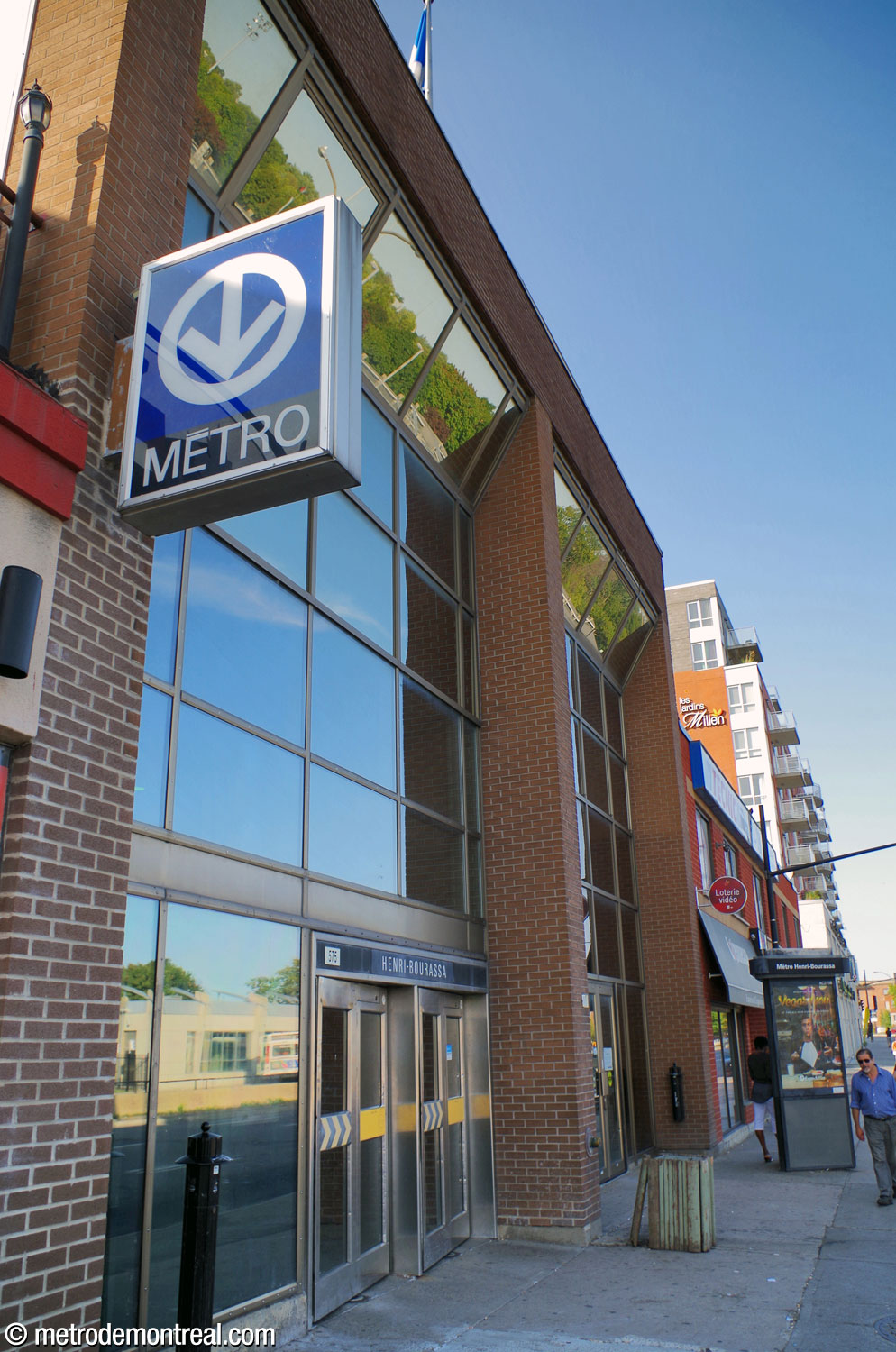 The exterior of the Henri-Bourassa Nord entrance, occupying half the façade of an office building.