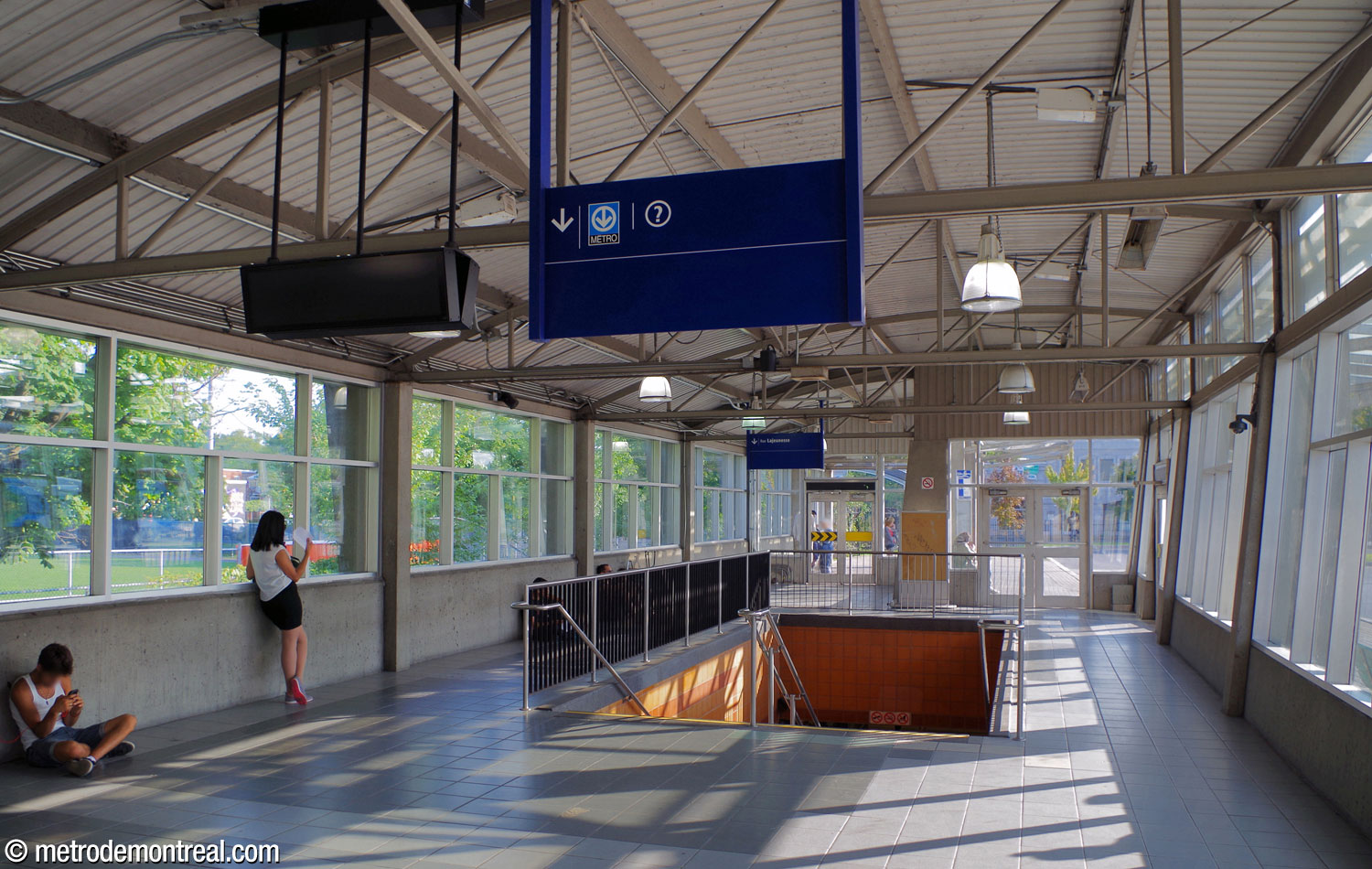 The stairwell down to the ticket hall from the south building of the bus terminal.