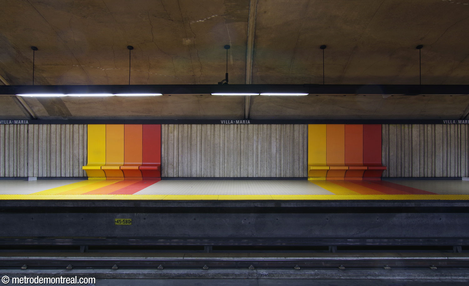 Two of the station's bench modules with their accompanying floor stripes, on the Montmorency platform.