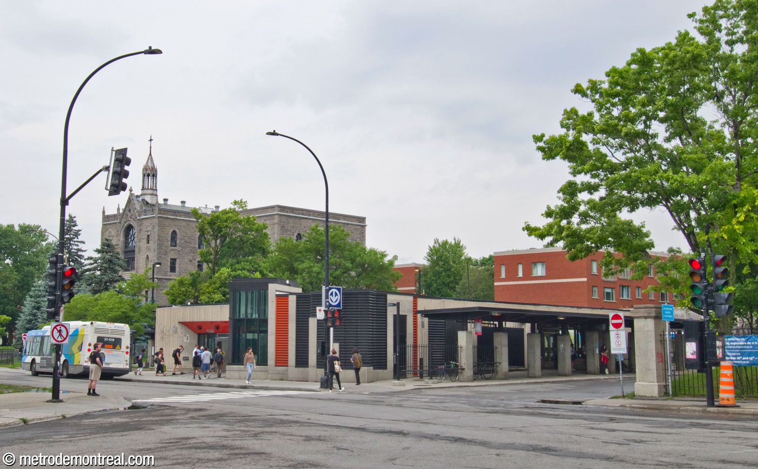 The station's headhouse seen from the southwest. A canopy on the south side of the station shelters the stops along the bus loop.